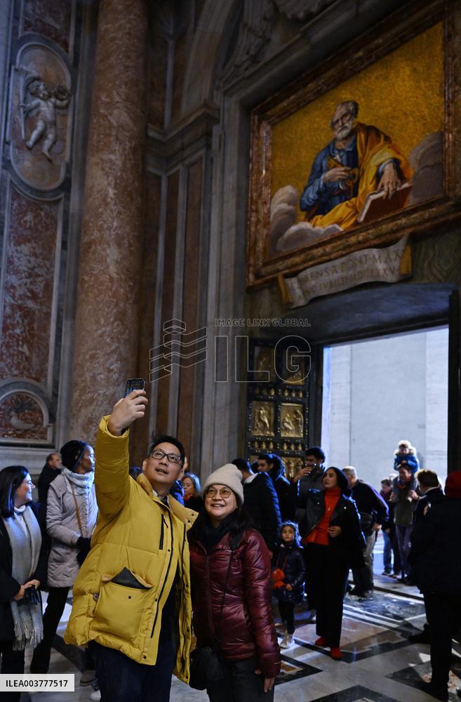 Pilgrims Walk Through The Holy Door Of St. Peter's Basilica - Vatican