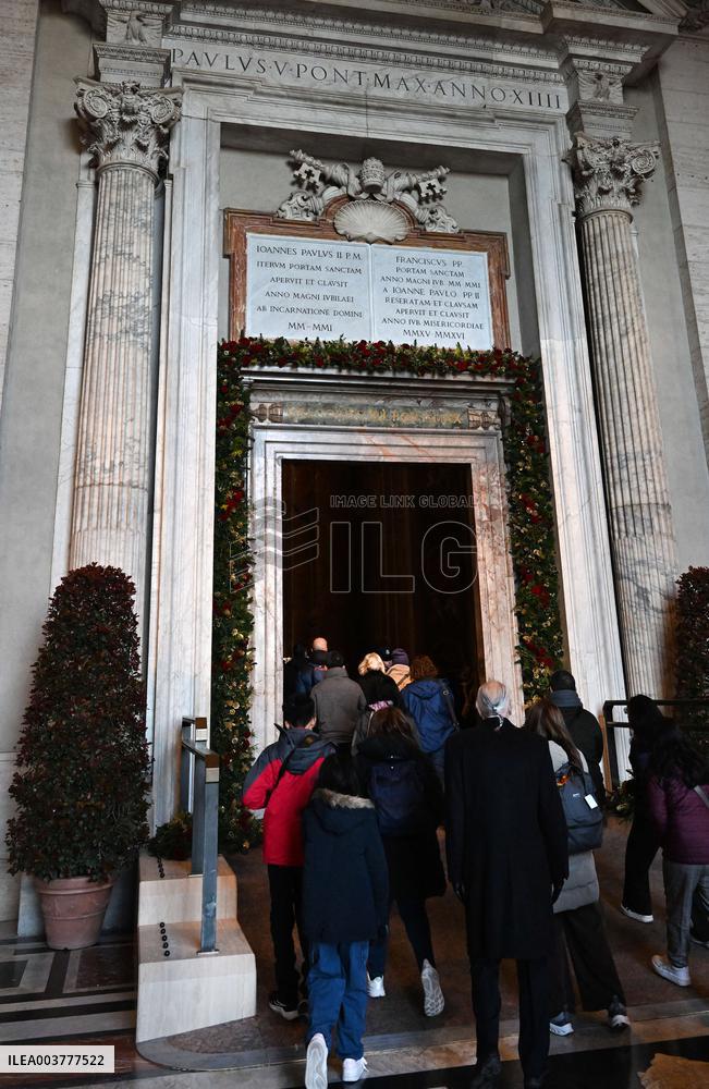 Pilgrims Walk Through The Holy Door Of St. Peter's Basilica - Vatican