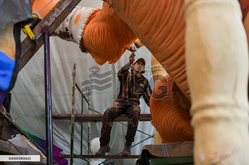 Artisans finish floats for Carnival parade of Blacks and Whites Carnival