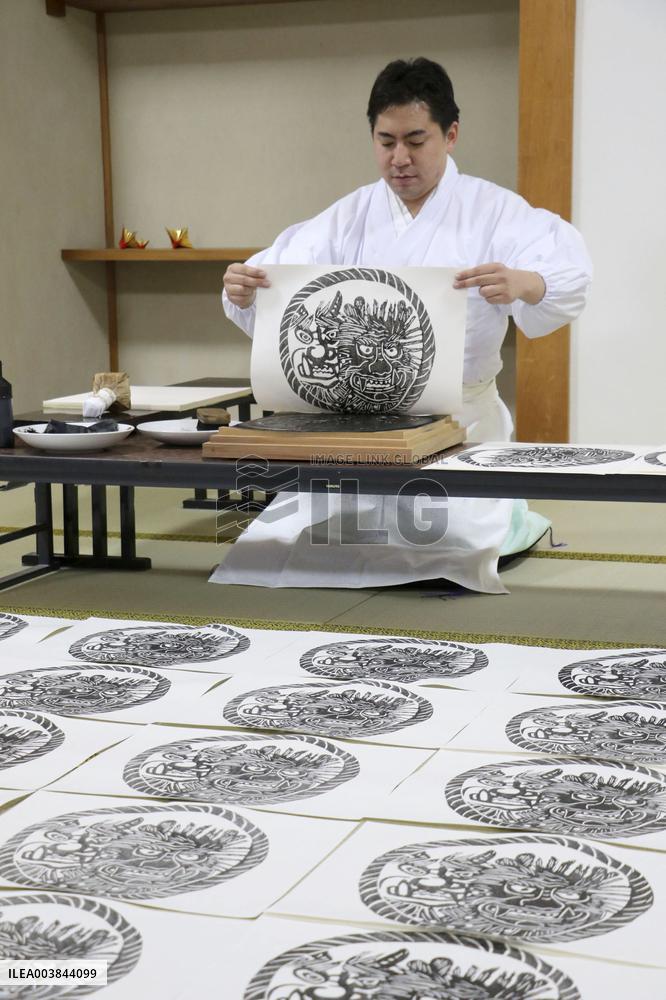 CORRECTED: Making of paper charms at Japanese shrine