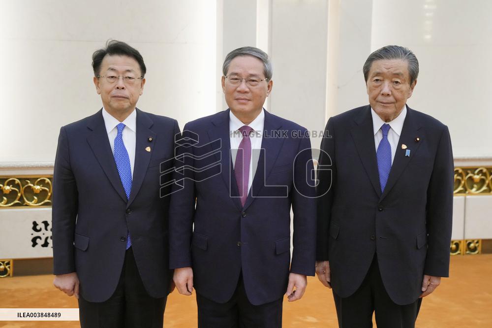 Japan ruling coalition lawmakers in Beijing