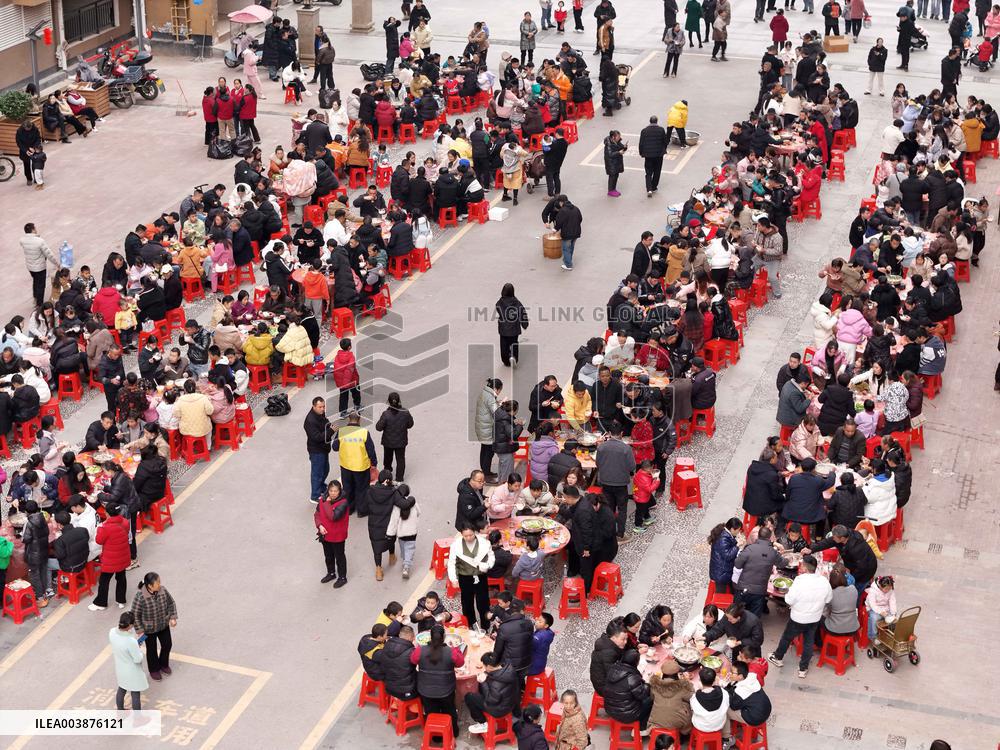 Community Owners Sit Around Tables and Eat Soup