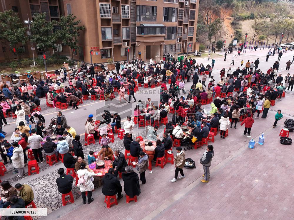 Community Owners Sit Around Tables and Eat Soup