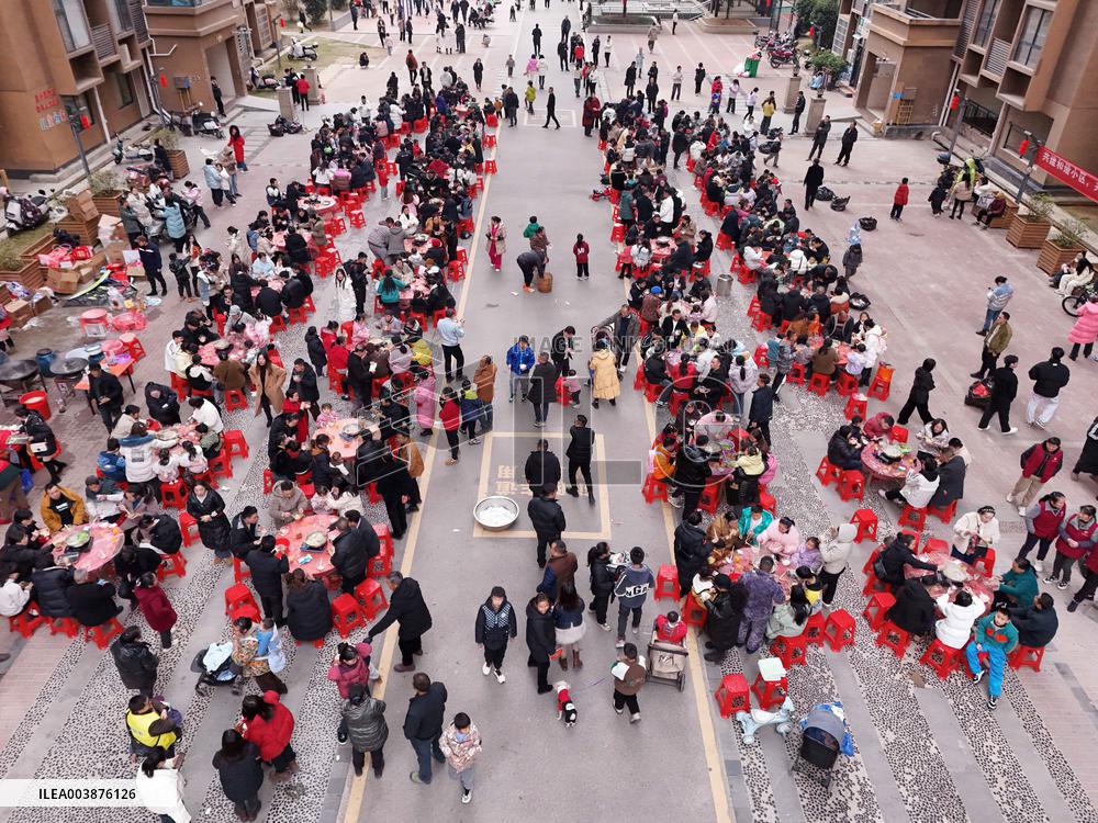 Community Owners Sit Around Tables and Eat Soup