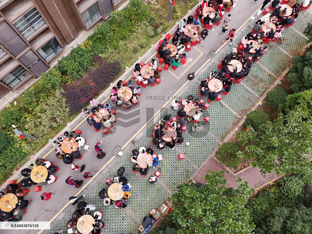 Community Owners Sit Around Tables and Eat Soup