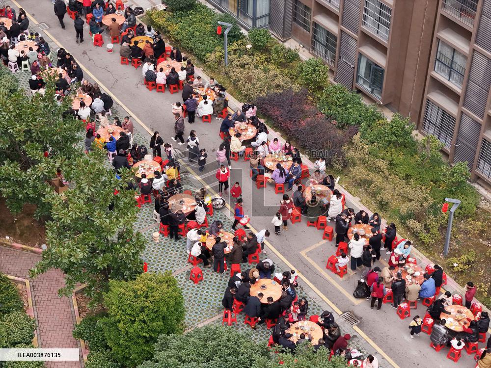 Community Owners Sit Around Tables and Eat Soup