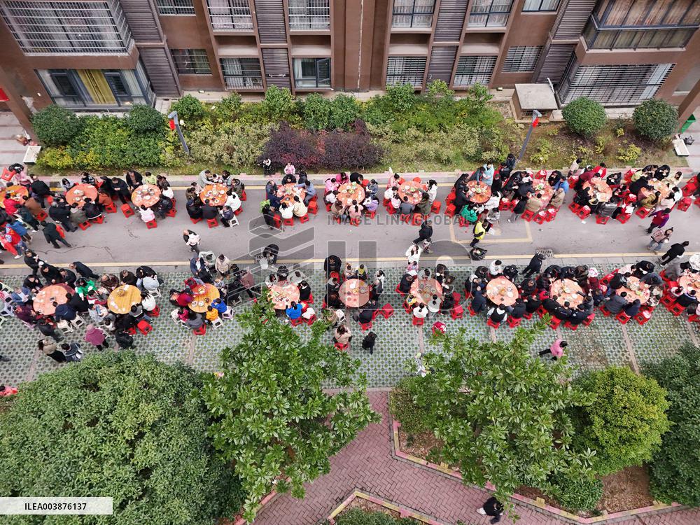 Community Owners Sit Around Tables and Eat Soup