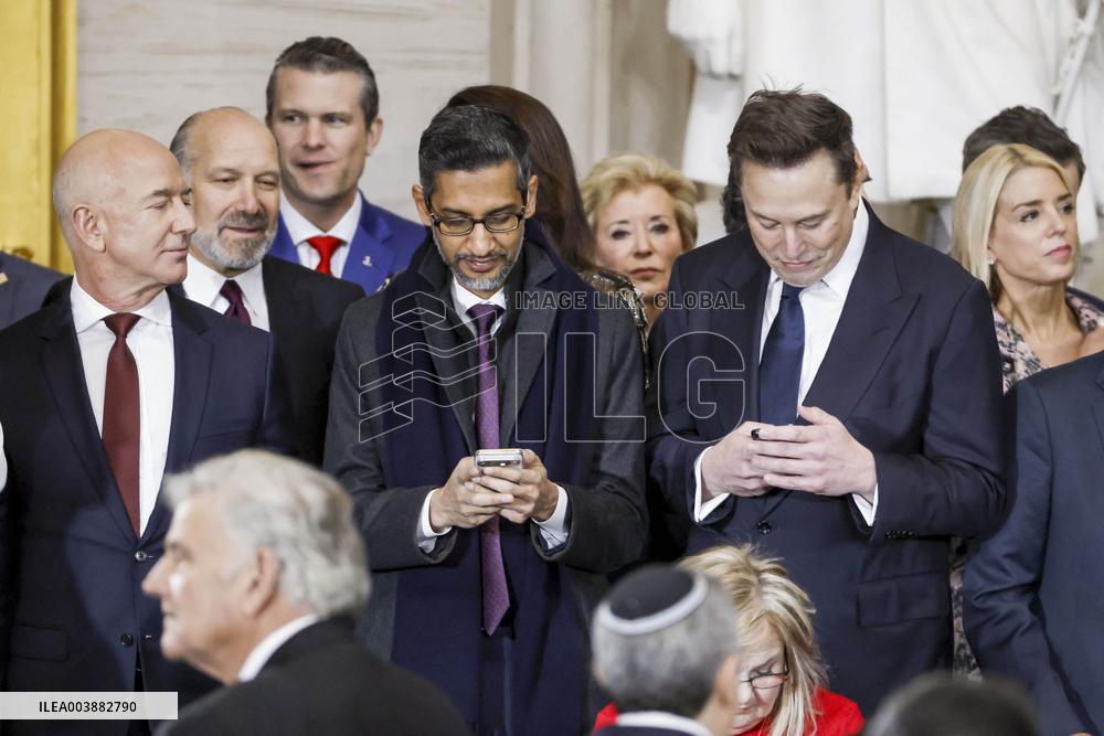Elon Musk Holds His Phone At Trump Inauguration - DC