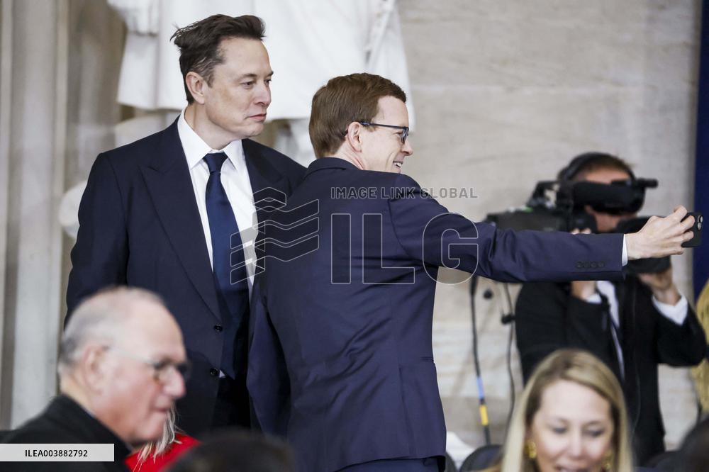 Elon Musk Holds His Phone At Trump Inauguration - DC