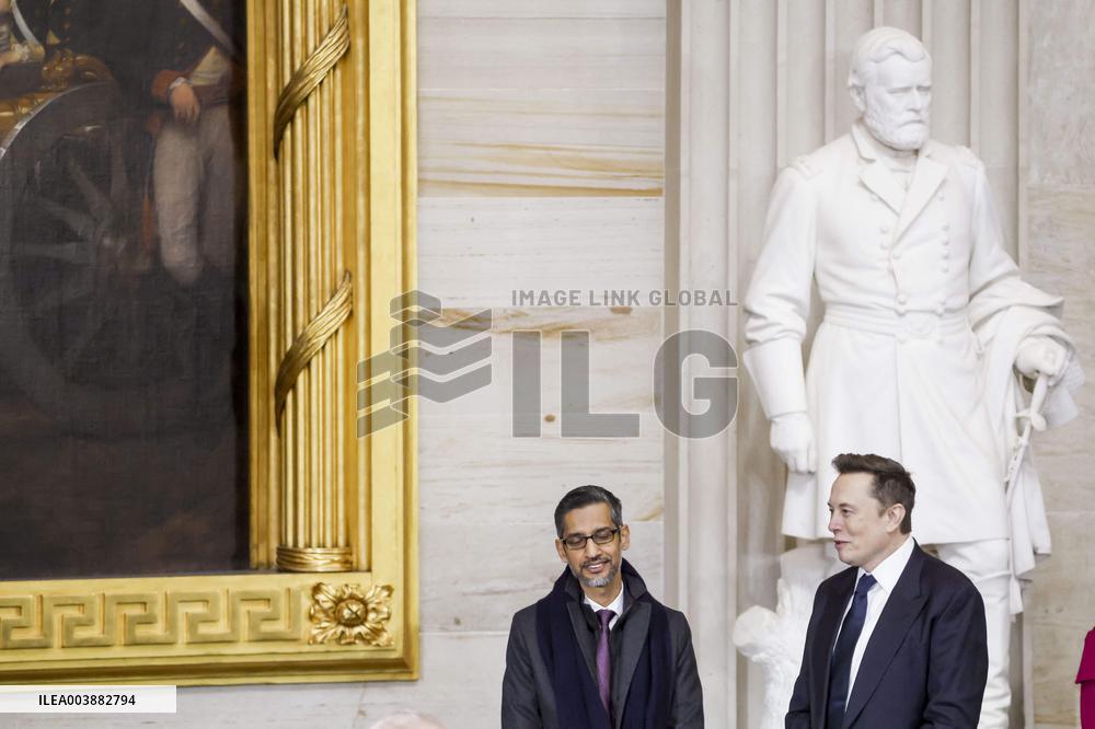 Elon Musk Holds His Phone At Trump Inauguration - DC