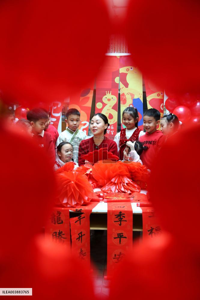Children Learning Folk Customs to Welcome Chinese Lunar New Year