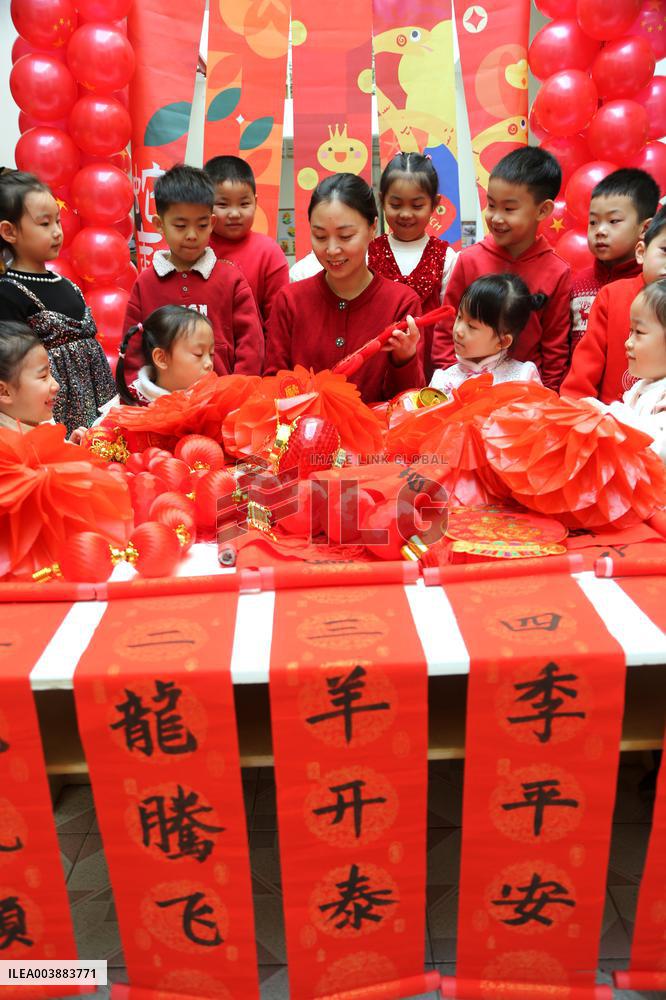 Children Learning Folk Customs to Welcome Chinese Lunar New Year