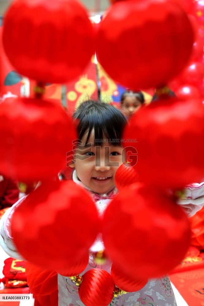 Children Learning Folk Customs to Welcome Chinese Lunar New Year