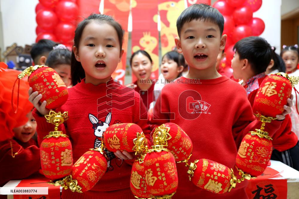 Children Learning Folk Customs to Welcome Chinese Lunar New Year