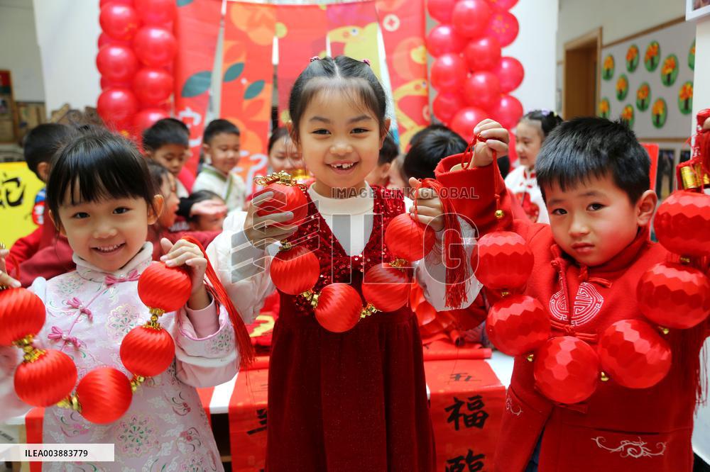 Children Learning Folk Customs to Welcome Chinese Lunar New Year