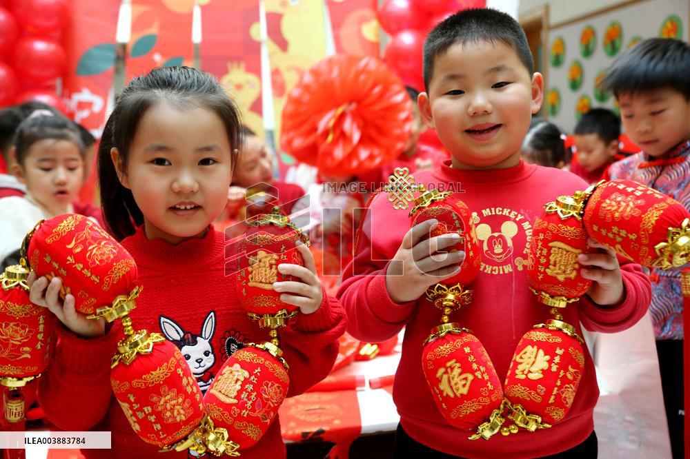 Children Learning Folk Customs to Welcome Chinese Lunar New Year