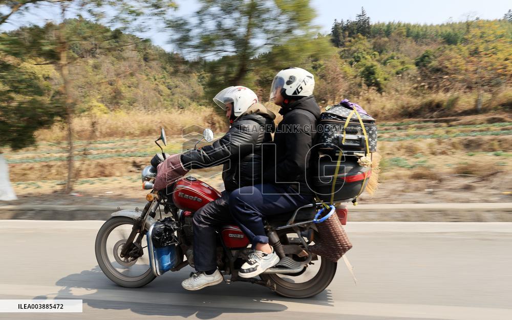 Migrant Workers Ride Motorcycles Home For Chinese Lunar New Year