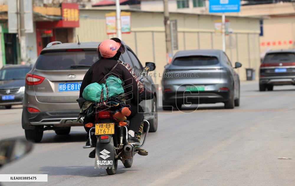 Migrant Workers Ride Motorcycles Home For Chinese Lunar New Year