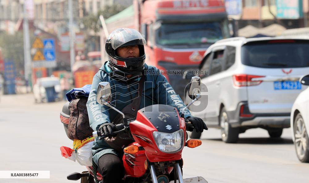 Migrant Workers Ride Motorcycles Home For Chinese Lunar New Year
