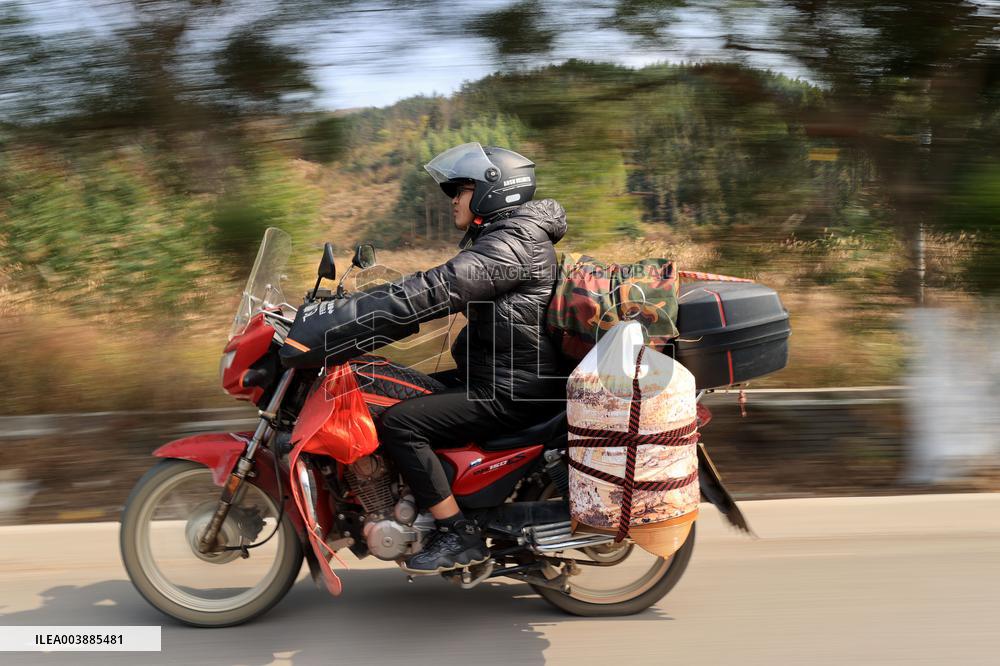 Migrant Workers Ride Motorcycles Home For Chinese Lunar New Year