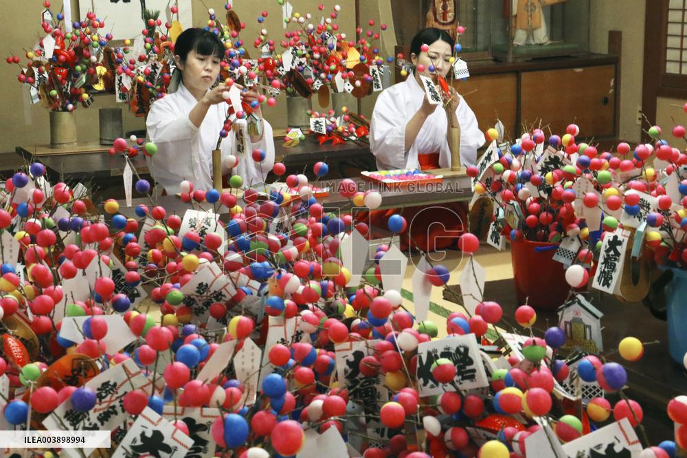 Making of lucky charms at Japan shrine