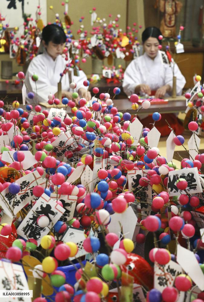 Making of lucky charms at Japan shrine