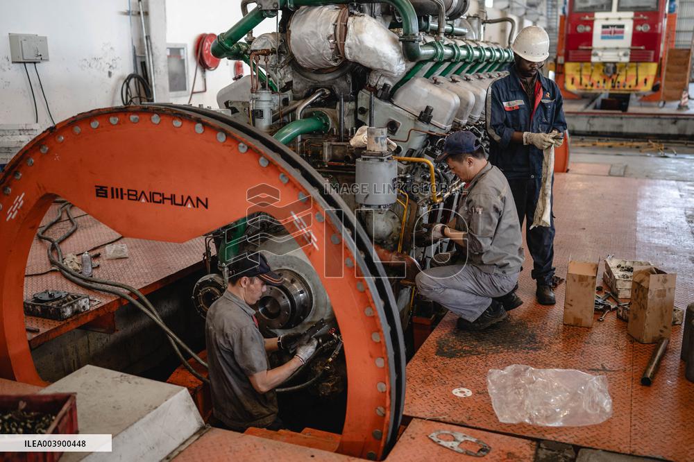 Maintenance Workers Fix Locomotive Parts - Nairobi