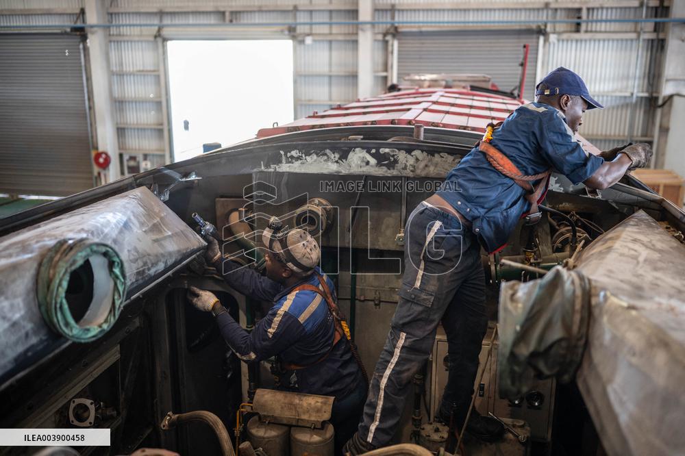 Maintenance Workers Fix Locomotive Parts - Nairobi
