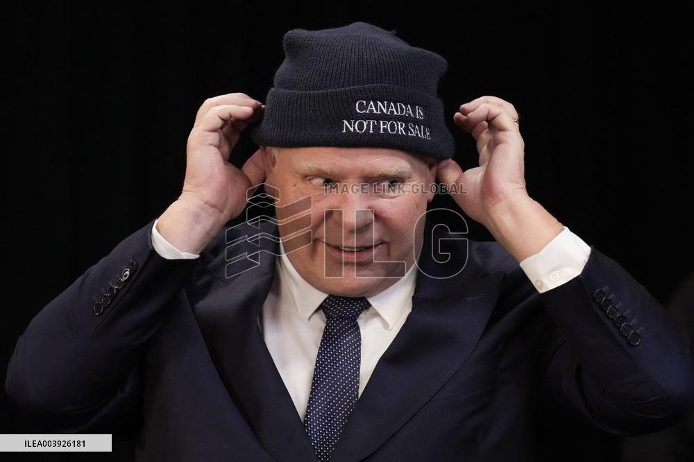 Doug Ford Hands Out 'Canada Is Not for Sale' Toques At A Press Conf.