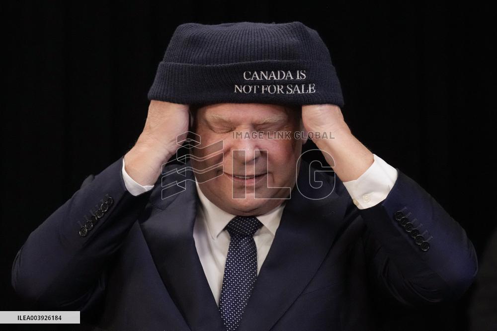 Doug Ford Hands Out 'Canada Is Not for Sale' Toques At A Press Conf.