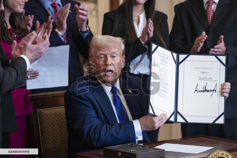 US President Donald Trump signs the Laken Riley Act
