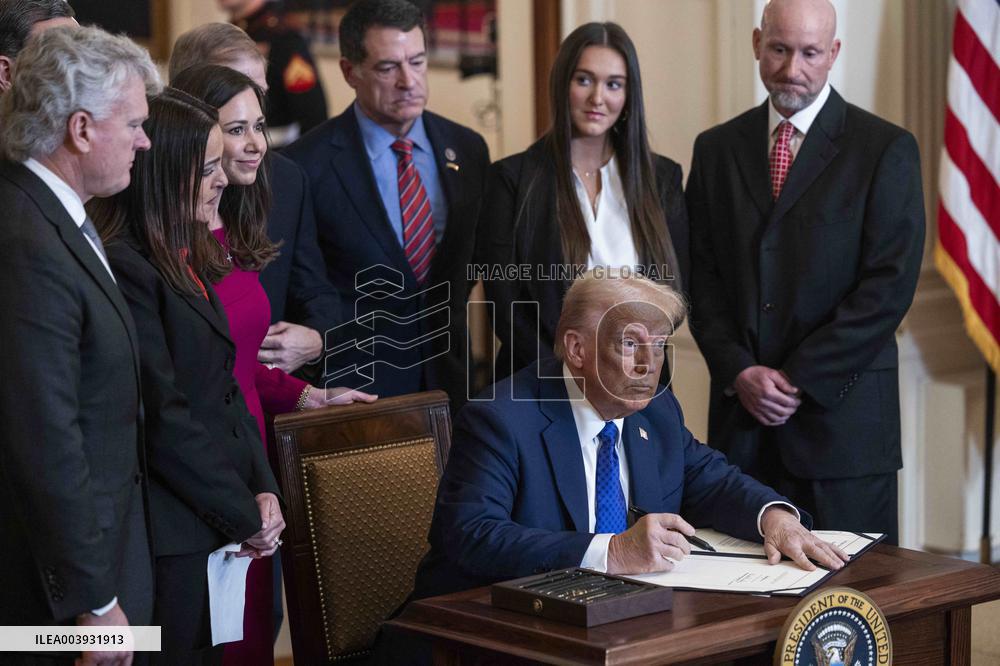 US President Donald Trump signs the Laken Riley Act