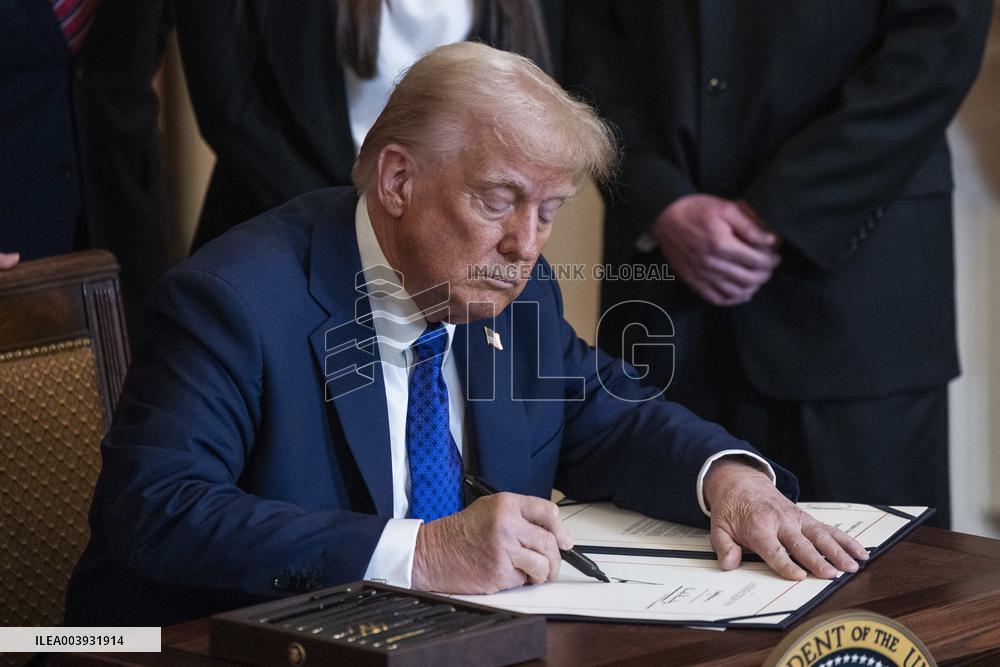 US President Donald Trump signs the Laken Riley Act