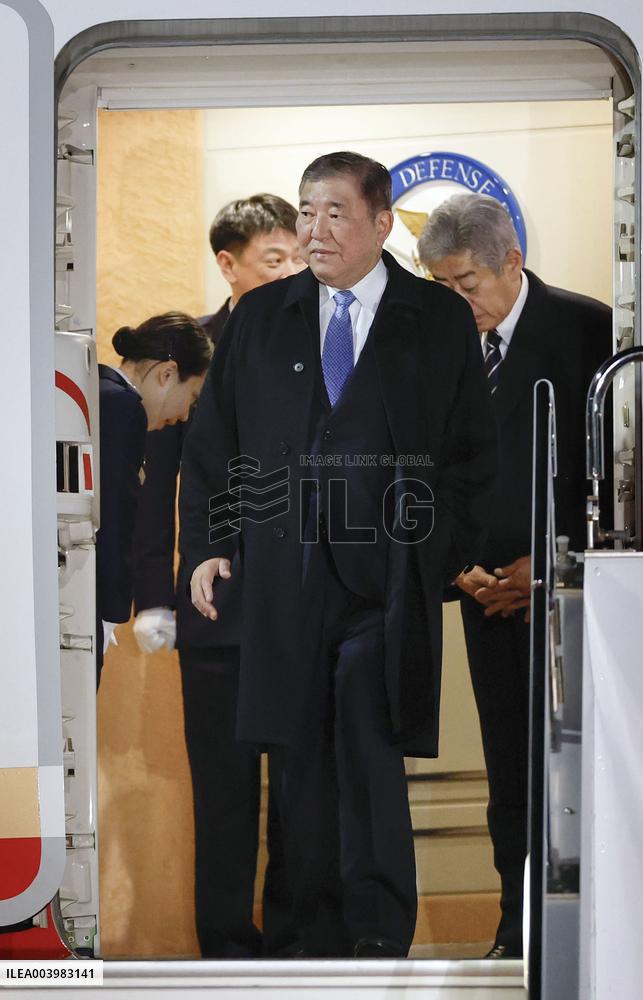 Japan PM Ishiba returns home