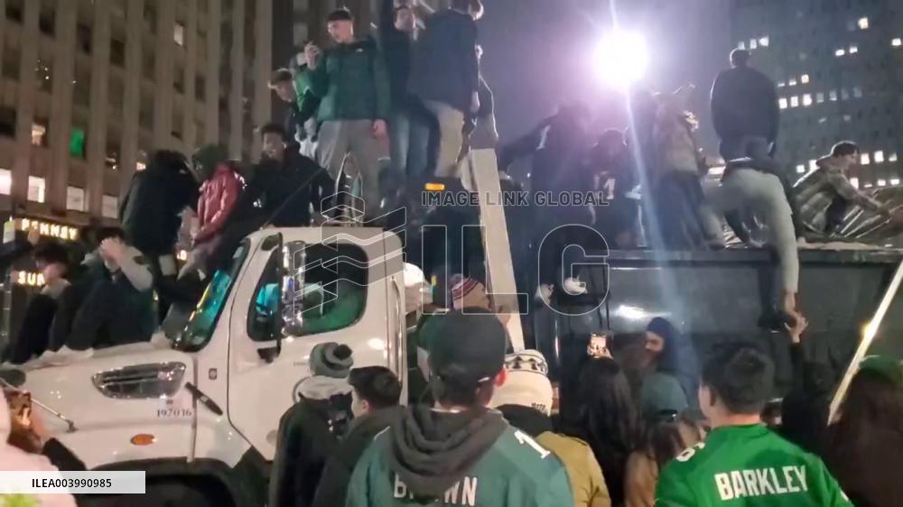US: Eagles Fans Climb Onto Trash Truck To Celebrate Super Bowl Win