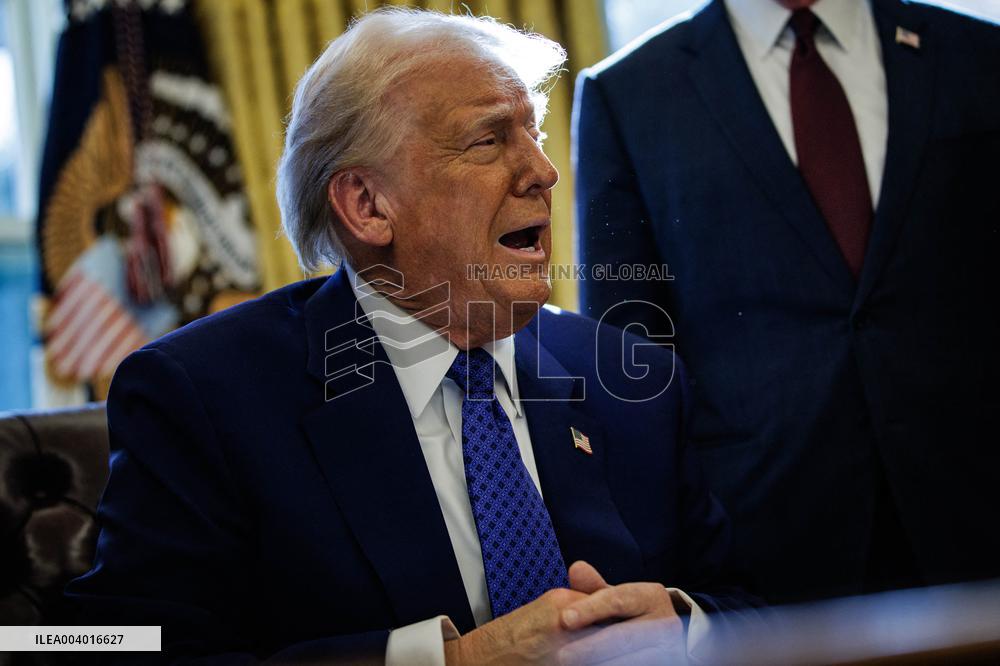 DC: U.S. President Trump Signs Executive Orders in the Oval Office