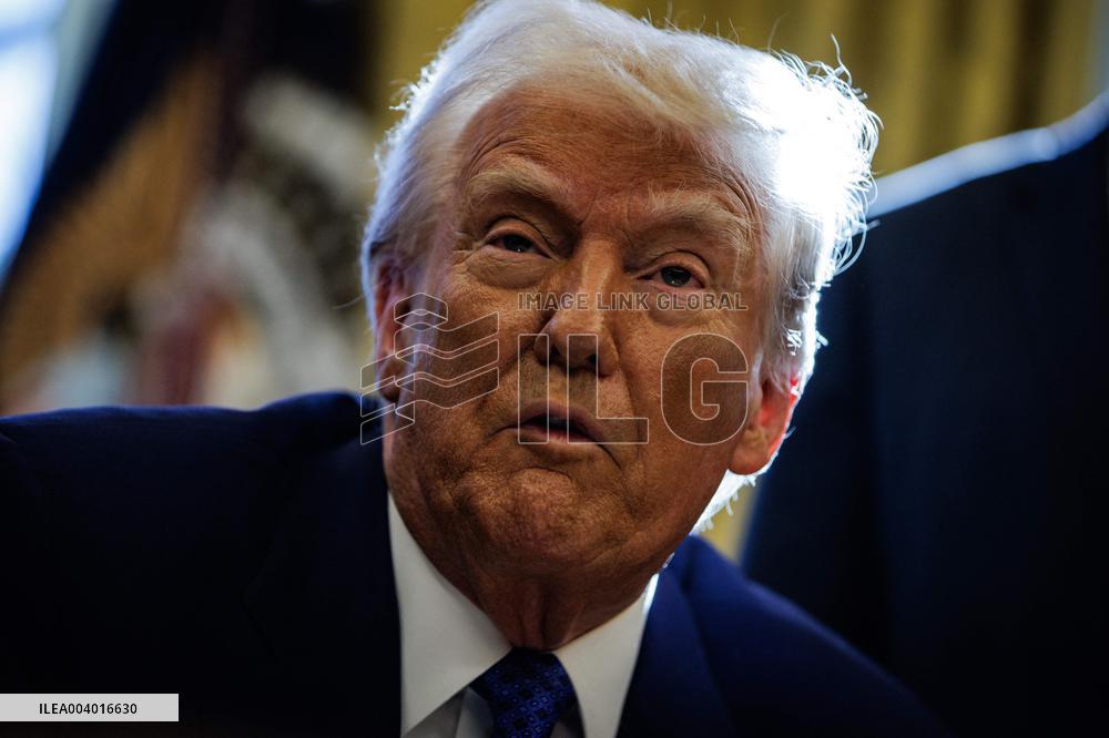 DC: U.S. President Trump Signs Executive Orders in the Oval Office