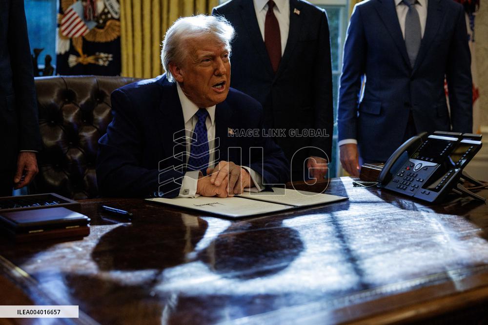 DC: U.S. President Trump Signs Executive Orders in the Oval Office