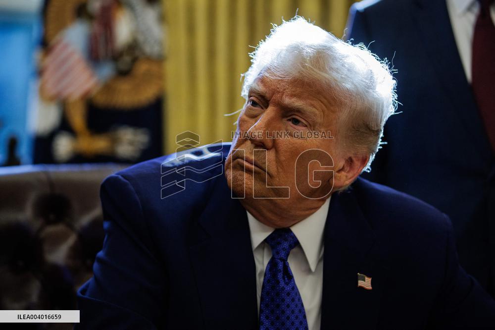 DC: U.S. President Trump Signs Executive Orders in the Oval Office