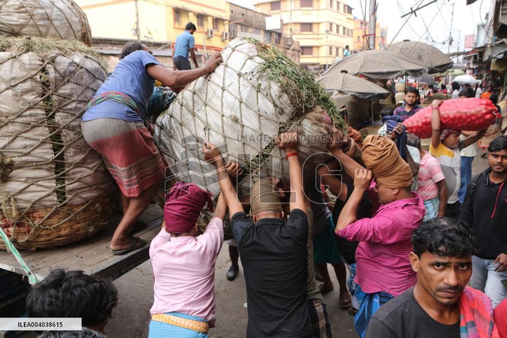 Labourers Unloading Vegetables Bags - India