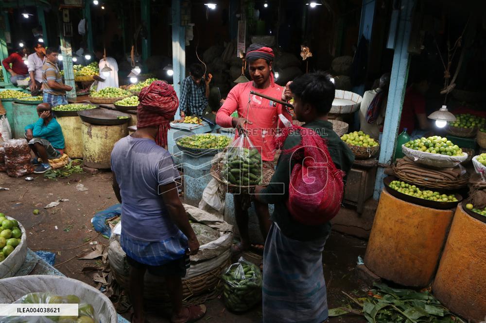 Labourers Unloading Vegetables Bags - India