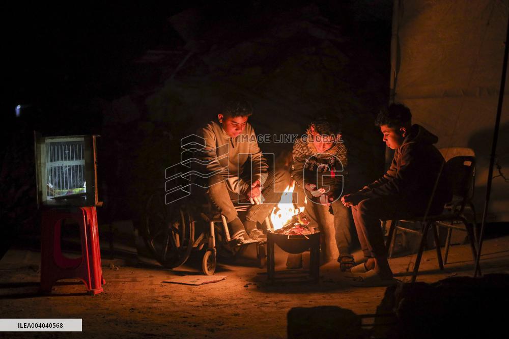 Displaced Palestinians Wait for Aid Amid the Rubble of Gaza’s Destruction