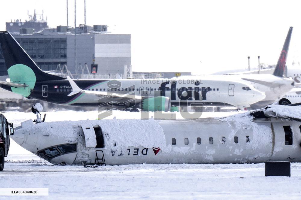 Delta plane with 80 passengers overturns at Toronto airport