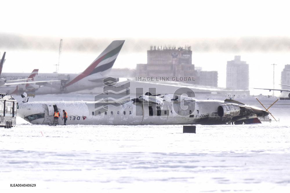 Delta plane with 80 passengers overturns at Toronto airport
