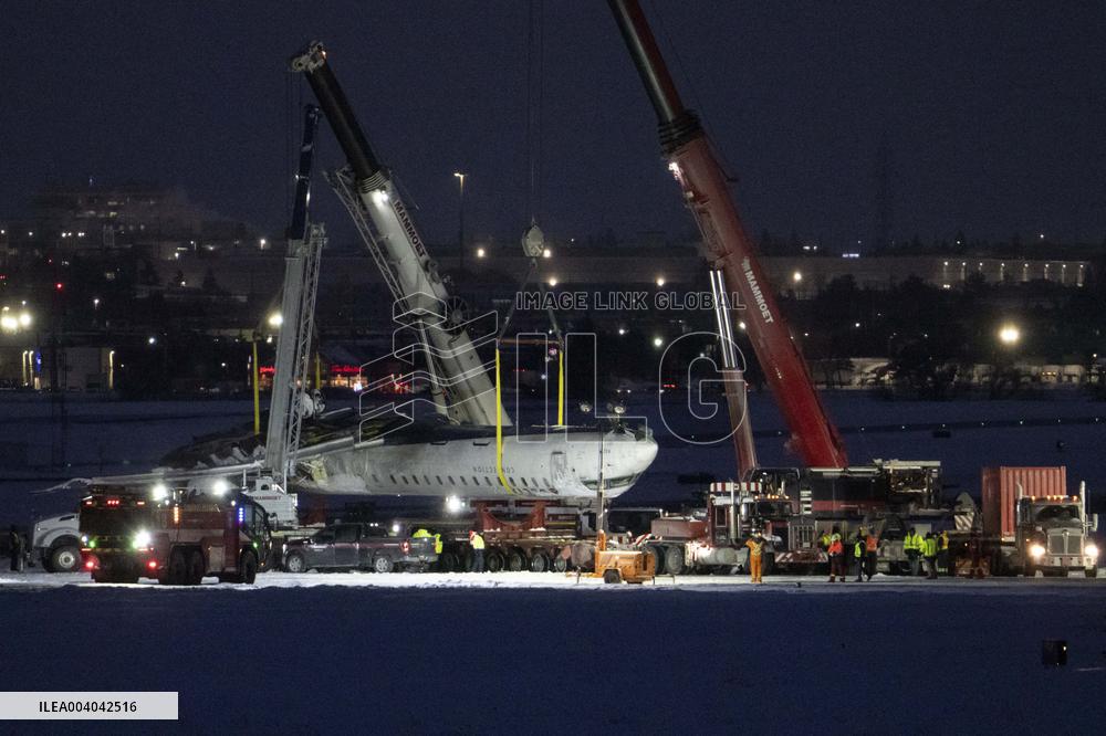 Cranes Lift Wreckage of Overturned Plane - Toronto