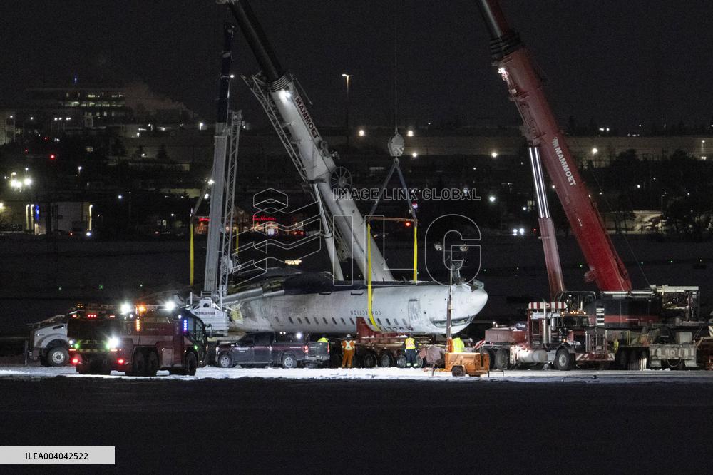 Cranes Lift Wreckage of Overturned Plane - Toronto
