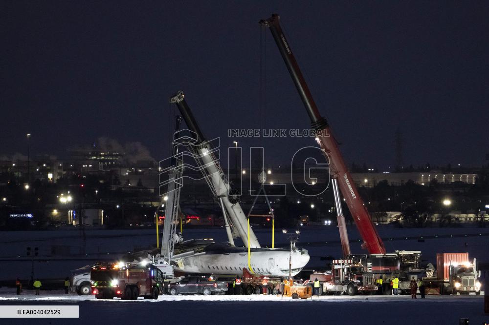 Cranes Lift Wreckage of Overturned Plane - Toronto