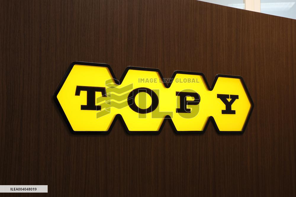 Topy Industries signage and logo