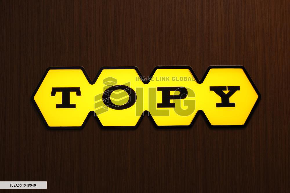 Topy Industries signage and logo