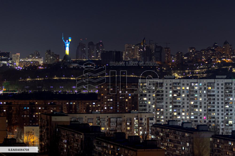 Motherland Monument shines in Ukraine's national colours